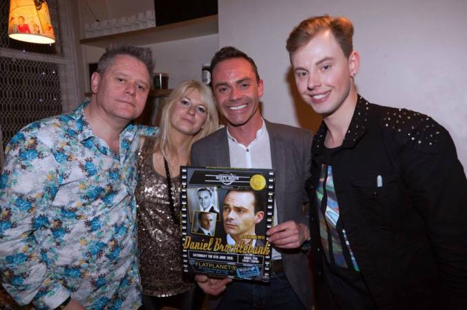 Stuart Morriss, Jen Morriss, Daniel Brocklebank & Chris Collins with the poster designed for the event by Ronnie Clark